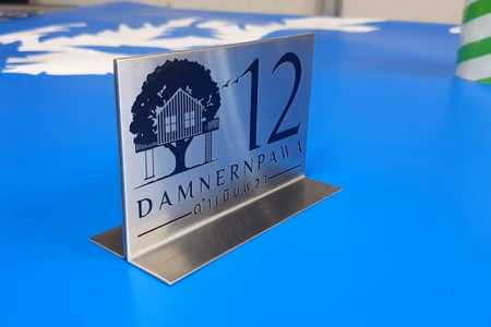 ผลงานป้ายสแตนเลสกัดกรด